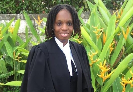 Senator Janeil Odle in professional attire, smiling confidently